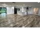 Open concept area with wood floors, a modern kitchen, island and lots of natural light at 1130 W Lake Brantley Rd, Altamonte Springs, FL 32714