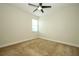 Cozy carpeted bedroom featuring a ceiling fan and one window at 1222 Castlevecchio Loop, Orlando, FL 32825