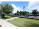 Community playground with play equipment and secure fencing at 1222 Castlevecchio Loop, Orlando, FL 32825