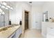 Well-lit bathroom with a shower, stylish vanity, and a large mirror for a clean and sophisticated look at 1274 Prince Ct, Lake Mary, FL 32746