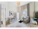 Cozy Bedroom with crib, recliner, and soft natural lighting at 1274 Prince Ct, Lake Mary, FL 32746