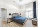 Stylish bedroom features a plush bed, mirrored nightstands and floor to ceiling windows at 1274 Prince Ct, Lake Mary, FL 32746