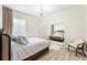 Airy bedroom with a chandelier, large window, mirrored closet, and comfortable seating for a luxurious feel at 1274 Prince Ct, Lake Mary, FL 32746