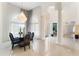 Grand dining room featuring a stunning chandelier, large windows, and elegant decor at 1274 Prince Ct, Lake Mary, FL 32746