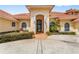 Welcoming entrance with arched doorway and manicured landscape at 1274 Prince Ct, Lake Mary, FL 32746