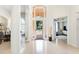 Elegant foyer with soaring ceilings, a chandelier, and views into dining and living areas at 1274 Prince Ct, Lake Mary, FL 32746