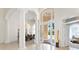 Elegant foyer featuring a chandelier and views into dining and living spaces at 1274 Prince Ct, Lake Mary, FL 32746