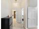 Hallway with tile flooring and multiple doorways leading to other rooms, enhancing flow and accessibility at 1274 Prince Ct, Lake Mary, FL 32746