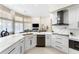 Spacious kitchen with white cabinets, stainless steel appliances and marble counter tops at 1274 Prince Ct, Lake Mary, FL 32746