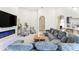 Expansive living room featuring a comfortable sectional sofa, fireplace, and seamless flow to the kitchen at 1274 Prince Ct, Lake Mary, FL 32746