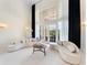 Bright living room boasting high ceilings, large windows, and modern, curved sofas at 1274 Prince Ct, Lake Mary, FL 32746