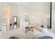 Bright living room boasting high ceilings, large windows, and modern, curved sofas at 1274 Prince Ct, Lake Mary, FL 32746