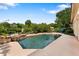 A luxurious pool with a rock waterfall feature and ample space for relaxation and enjoyment at 1274 Prince Ct, Lake Mary, FL 32746