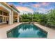 Backyard showcasing a tranquil pool with lush landscaping, offering a serene retreat at 1274 Prince Ct, Lake Mary, FL 32746