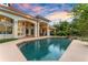 Beautiful pool and patio area with lush landscaping, creating a relaxing outdoor space at 1274 Prince Ct, Lake Mary, FL 32746