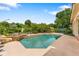 Gorgeous pool with a rock waterfall feature, nestled within a beautifully landscaped backyard at 1274 Prince Ct, Lake Mary, FL 32746