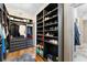 Spacious walk-in closet with custom shelving units and a plush rug at 1274 Prince Ct, Lake Mary, FL 32746