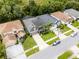 Beautiful aerial view showcases a home with landscaped front yard and a neatly paved driveway at 13431 Early Frost Cir, Orlando, FL 32828