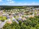 Aerial view of a well-planned community featuring varied architectural styles, lush landscaping and mature trees at 13431 Early Frost Cir, Orlando, FL 32828
