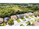 This aerial view shows well-maintained homes with green lawns in a Gathering-friendly neighborhood near green space at 13431 Early Frost Cir, Orlando, FL 32828