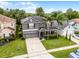 Well-manicured lawn, two-car garage, charming front porch at 13431 Early Frost Cir, Orlando, FL 32828