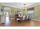 Comfortable dining room featuring a wooden table, chandelier, and ceramic tile floors at 13431 Early Frost Cir, Orlando, FL 32828