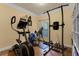 This room showcases an elliptical and various workout equipment with natural lighting at 13431 Early Frost Cir, Orlando, FL 32828