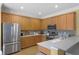 Spacious kitchen featuring stainless steel appliances, and ample counter space at 13431 Early Frost Cir, Orlando, FL 32828