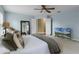 Spacious main bedroom featuring carpet flooring, and a sitting area with natural lighting at 13431 Early Frost Cir, Orlando, FL 32828