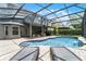 Beautiful screened-in pool with brick paver deck and plenty of space for outdoor seating at 13431 Early Frost Cir, Orlando, FL 32828