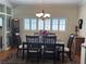 Elegant dining room with classic chandelier, plantation shutters, and seating for six at 1420 Knollwood St, Orlando, FL 32804