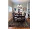 Formal dining room with hardwood floors, sideboard, and large windows at 1420 Knollwood St, Orlando, FL 32804