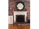 Close-up of the fireplace showcasing intricate details, decorative accents, and a charming ambiance at 1420 Knollwood St, Orlando, FL 32804