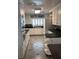 Spacious kitchen with white cabinets, black counters, and stainless steel appliances at 1420 Knollwood St, Orlando, FL 32804