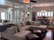 Spacious living room featuring a large sectional sofa, stylish decor, and abundant natural light at 1420 Knollwood St, Orlando, FL 32804