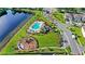 Overhead shot showcasing the community pool, playground, and lush landscaping in this neighborhood near the lake at 15577 Willow Arbor Cir, Orlando, FL 32824