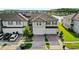 Aerial view of charming townhomes showcasing well-manicured lawns and serene lakeside living at 15577 Willow Arbor Cir, Orlando, FL 32824