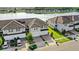 Aerial view of stunning townhomes, well-manicured lawns, and peaceful lakeside living at 15577 Willow Arbor Cir, Orlando, FL 32824