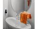 Bathroom featuring a vessel sink and orange towel at 15577 Willow Arbor Cir, Orlando, FL 32824