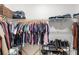 Walk-in closet featuring clothing racks, shelves, and ample storage space for shoes and accessories at 15577 Willow Arbor Cir, Orlando, FL 32824