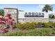 Arbors at Meadow Woods community sign made of stone with manicured landscaping around it at 15577 Willow Arbor Cir, Orlando, FL 32824