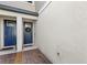 Stylish entryway with a blue front door, wreath decor, and brick pavers at 15577 Willow Arbor Cir, Orlando, FL 32824