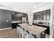 Spacious kitchen with stainless steel appliances, granite countertops, and an island with bar seating at 15577 Willow Arbor Cir, Orlando, FL 32824
