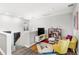 Comfortable loft area with colorful decor and wood floors at 15577 Willow Arbor Cir, Orlando, FL 32824