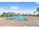 Beautiful community swimming pool with a pavilion and palm trees, perfect for relaxation and recreation at 15577 Willow Arbor Cir, Orlando, FL 32824