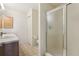 Bathroom featuring a modern walk-in shower with sliding glass door, alongside the vanity and toilet at 17097 Se 96Th Chapelwood Cir, The Villages, FL 32162