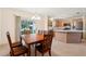 Bright dining area with sliding doors, leading to kitchen, great for entertaining guests at 17097 Se 96Th Chapelwood Cir, The Villages, FL 32162