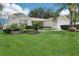 Charming home with well-kept lawn, landscaped yard, and inviting curb appeal at 17097 Se 96Th Chapelwood Cir, The Villages, FL 32162