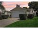 The garage of this cozy property with a well maintained lawn at 17097 Se 96Th Chapelwood Cir, The Villages, FL 32162
