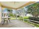 View of a spacious screened-in lanai, ideal for outdoor relaxation at 17097 Se 96Th Chapelwood Cir, The Villages, FL 32162